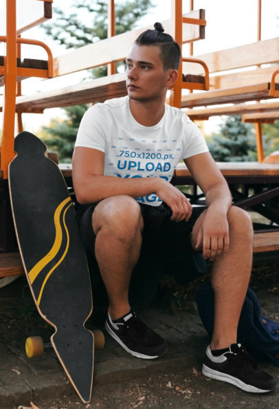 T-Shirt Mockup of a Young Skater Sitting at a Park 43465r-el2
