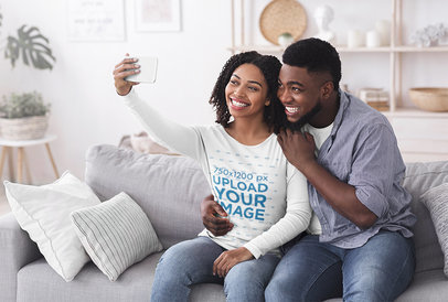 Long Sleeve Tee Mockup of a Happy Couple Taking a Selfie at Home