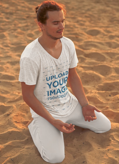 V-Neck T-Shirt Mockup of a Man Meditating in the Beach