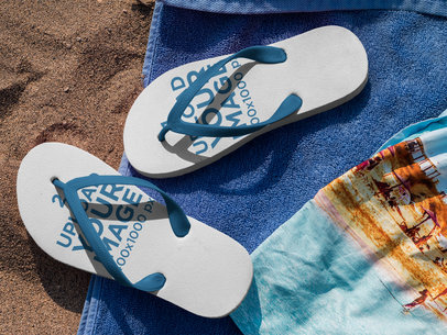 Two Flip Flops Mockup Lying Over a Towel at the Beach