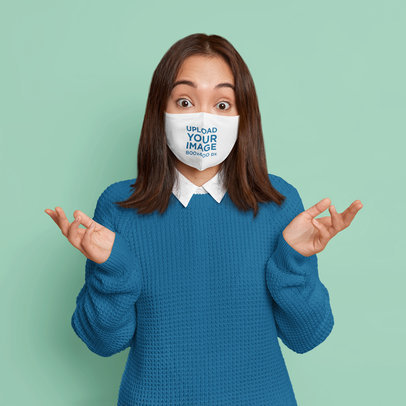Face Mask Mockup Featuring a Confused Woman in a Studio