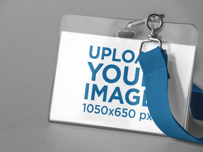 Closeup of a Badge Holder Mockup Standing Against a Solid Color Background