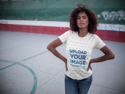 Mockup of a Woman Wearing a Round Neck Tee While at a Basketball Court