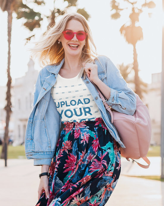 Mockup of a Happy Woman Wearing a T-Shirt on the Street