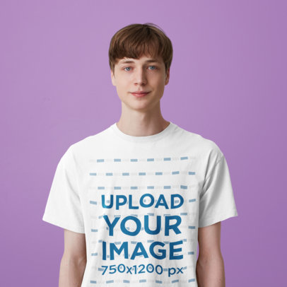T-Shirt Mockup of a Young Man Standing Against a Plain Color Backdrop