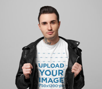 T-Shirt Mockup Featuring a Cool Tattooed Man in a Studio