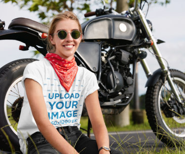 T-Shirt Mockup of a Young Woman Posing by a Motorcycle