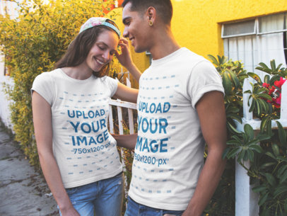 Smiling Couple in the Street Wearing Round Neck T-Shirts Mockup