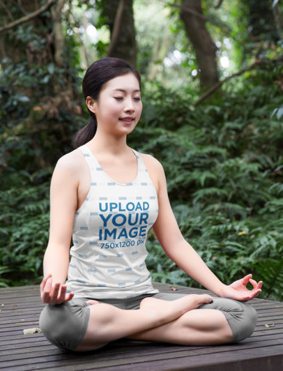 Tank Top Mockup of a Woman Meditating in the Middle of the Woods m3970-r-el2