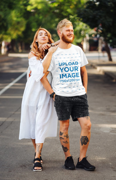 T-Shirt Mockup of a Tattooed Man Posing With His Girlfriend