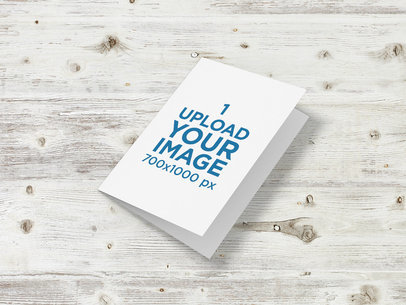 Mockup of a Closed Greeting Card Placed on a Wooden Surface 5226-el1