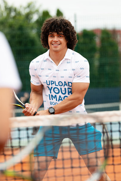 Polo Shirt Mockup of a Muscular Man Playing Tennis