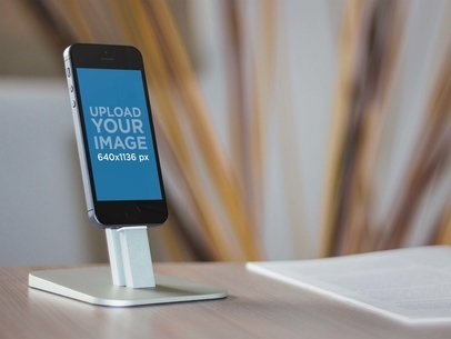Mockup Featuring an iPhone 5s Space Grey With Stand 