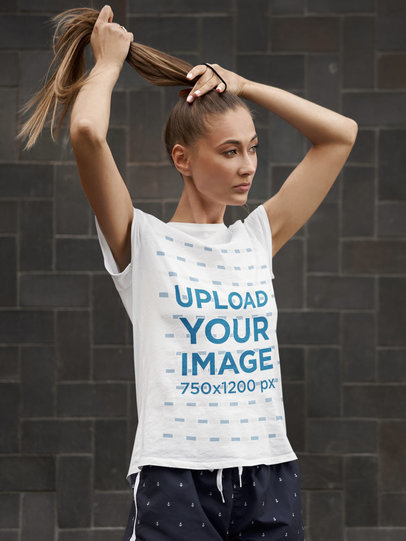 Activewear Mockup Featuring a Woman Wearing a T-Shirt and Fixing Her Hair m4050-r-el2