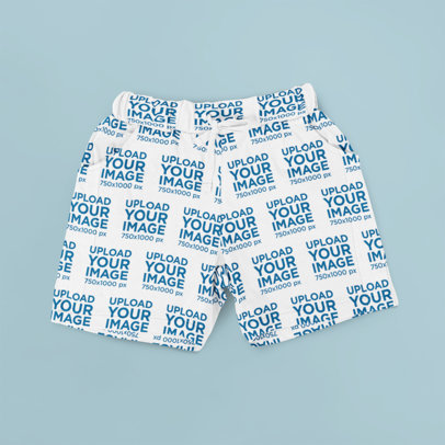 Mockup of a Flat Laid Pair of Shorts over a Customizable Surface m3260-r-el2