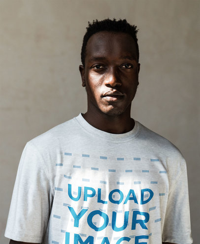 Mockup of a Serious Man Wearing a Heathered T-Shirt Under the Sunlight M4332-r-el2