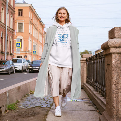 Hoodie Mockup of a Woman Walking in a European City m3668-r-el2