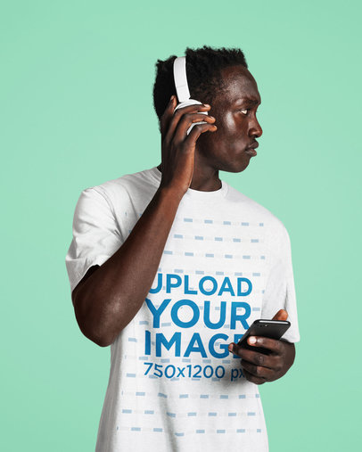 T-Shirt Mockup Featuring a Man Wearing Headphones in a Studio M4333-r-el2