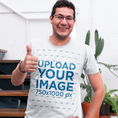 Happy Guy Wearing a Round Neck Tee Mockup While at the Office a15525