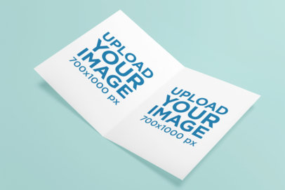Mockup of a Customizable Greeting Card Placed on a Solid Color Surface
