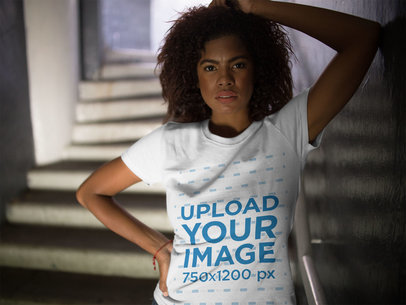 Mockup of a Woman Hiding on Stairways While Wearing a Round Neck T-Shirt 
