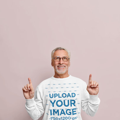 Sweatshirt Mockup of a Senior Man Pointing Upwards