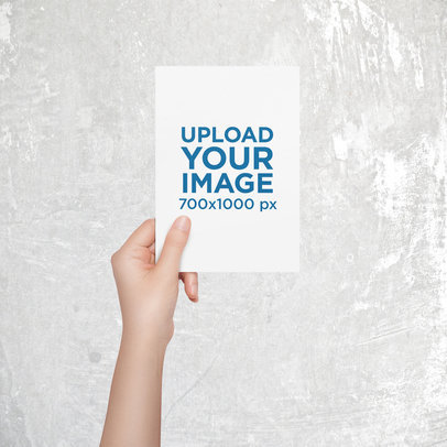 Mockup of a Woman Holding a Greeting Card Against a Customizable Background
