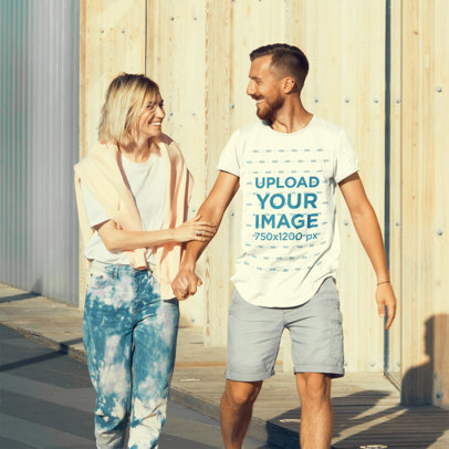T-Shirt Mockup of a Bearded Man Holding His Girlfriend's Hand