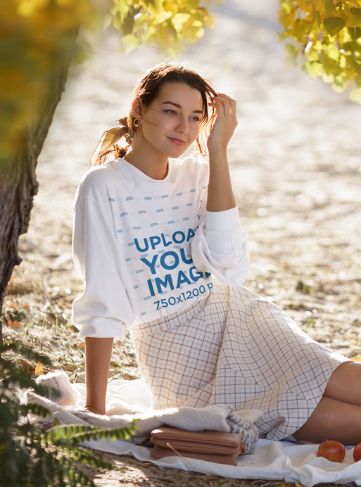 Sweatshirt Mockup of a Young Woman Relaxing on a Picnic