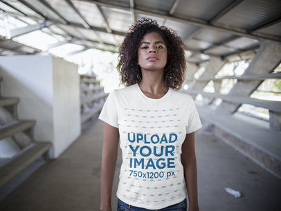 Young Woman with Defying Look Wearing a Round Neck Tee Mockup in the City