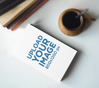 Book Mockup Featuring a Cup of Coffee m3813r-el2