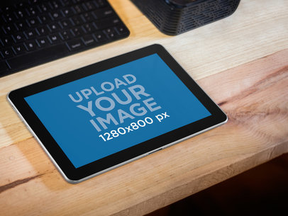 Mockup of a Samsung 4G Lite Silver over a Wooden Desk