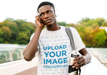 T-Shirt Mockup Featuring a Serious Man Wearing Headphones  