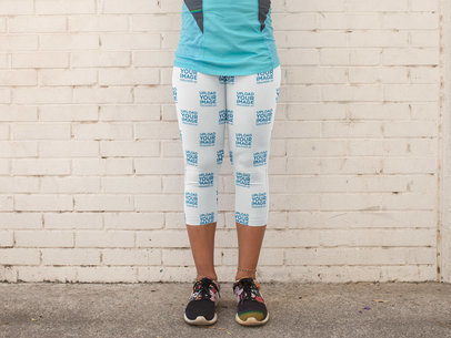 Leggings Mockup Being Worn by a Girl While Against a White Bricks Wall a15329
