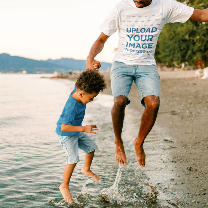 T-Shirt Mockup Featuring a Dad and His Son Having Fun by a Lake 