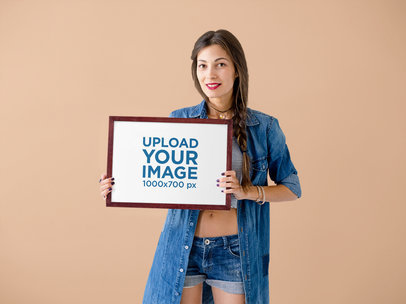 Mockup of a Young Woman Holding a Piece of Art Print in Her Hands M4007-r-el2