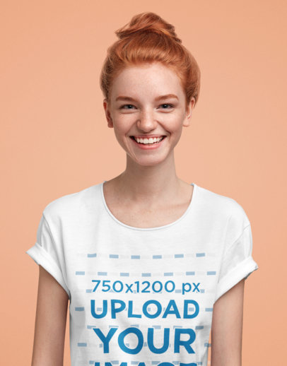 T-Shirt Mockup of a Happy Red-Haired Woman in a Studio