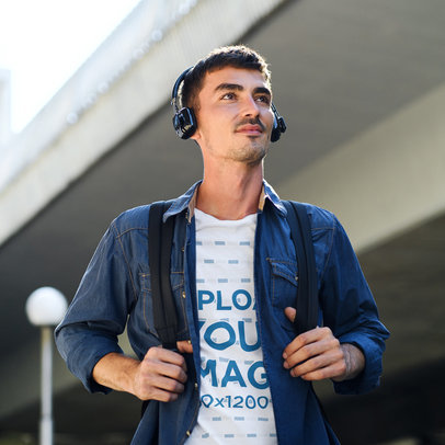 T-Shirt Mockup Featuring a Man Wearing a Headset Device on a Street
