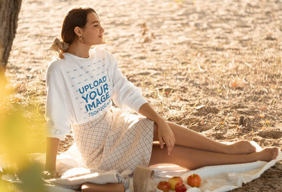 Sweatshirt Mockup of a Woman Under a Tree Having a Picnic by Herself