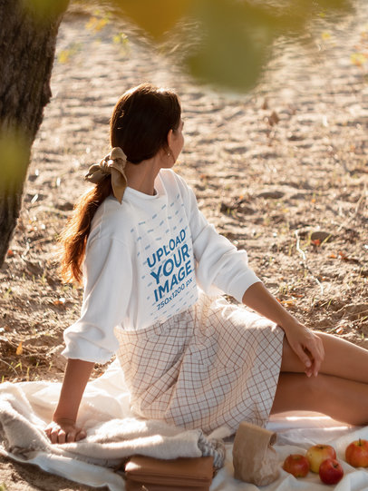 Sweatshirt Mockup of a Young Woman Enjoying a Picnic