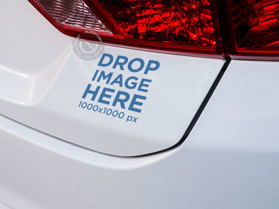 Mockup of a Sticker on the Back of a White Car