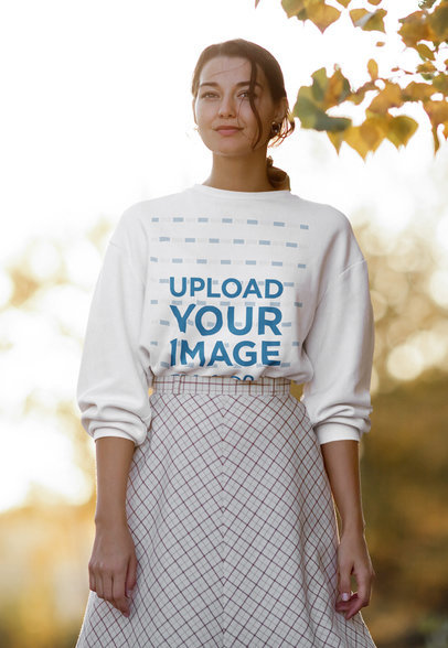 Sweatshirt Mockup of a Young Woman in an Outdoor Fall-Season Setting