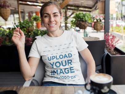 Middle Aged Woman Smoking at a Cafe While Wearing a Round Neck Tee Mockup