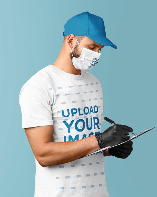 T-Shirt Mockup of a Delivery Man with a Face Mask at a Studio
