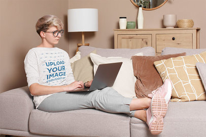 Heather Sweatshirt Mockup of a Short-Haired Woman Working on Her Couch m4723-r-el2