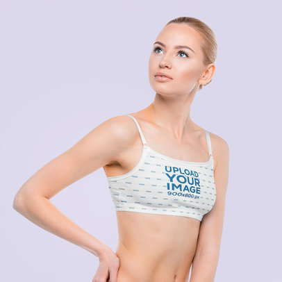 Sports Bra Mockup of a Woman Posing in a Studio