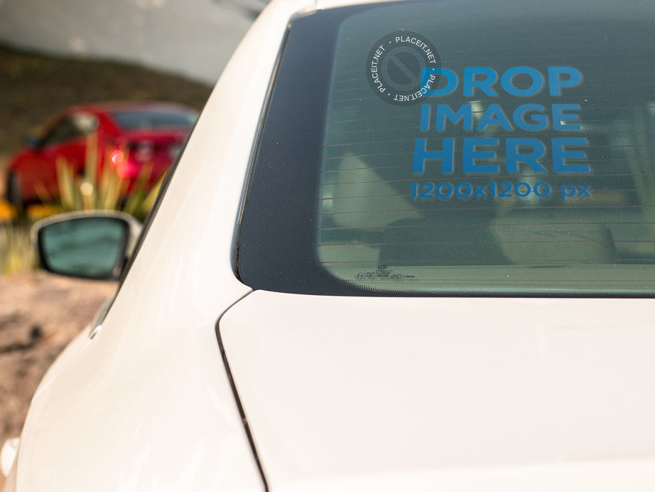 Square Window Decal Mockup on the Back Window of a White Sedan Car