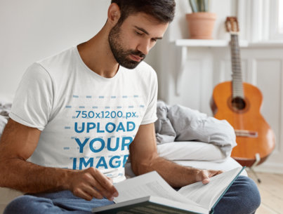 T-Shirt Mockup of a Bearded Man Studying in His Room