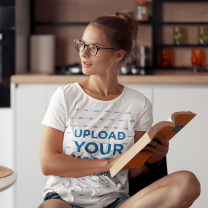 Round-Neck T-Shirt Mockup Featuring a Woman With an Open Book