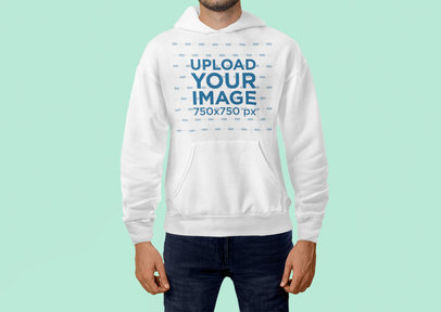 Mockup of a Man Standing at a Studio with a Pullover Hoodie